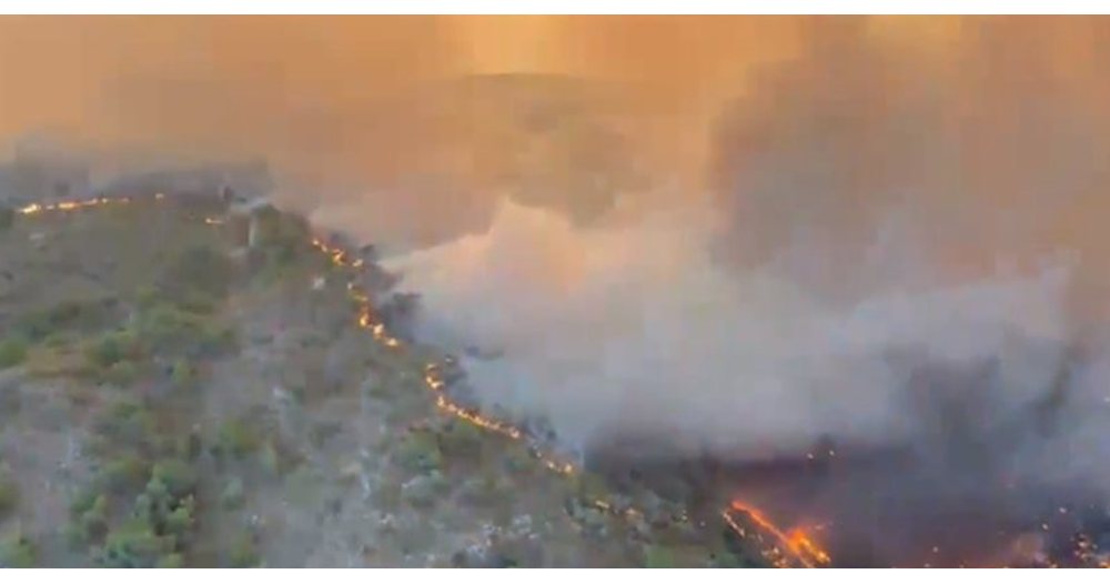 The fire has burned about 6,600 hectares and forced the evacuation of nearly 1,500 people, authorities said