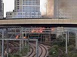 Around 60 firefighters and eight engines tackle bushfires near the railway; power to tracks isolated
