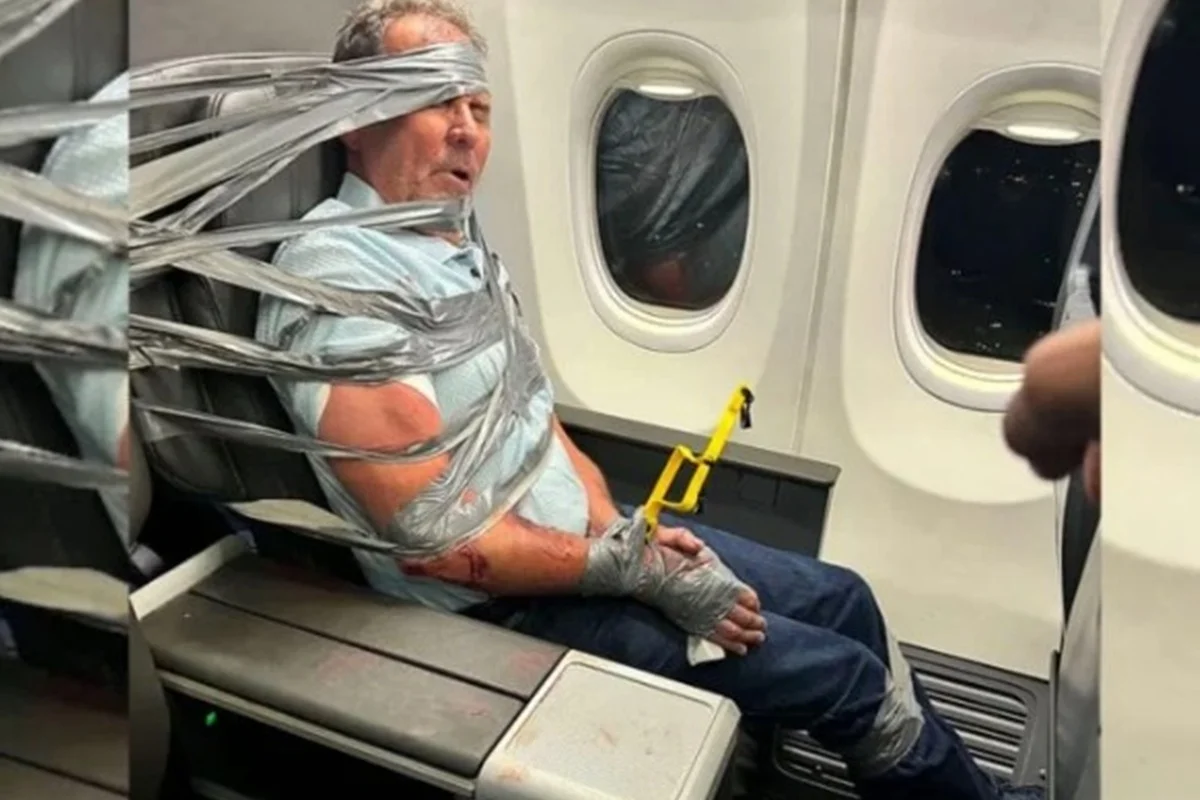 Man is contained with tape in flight after racist and homophobic attacks