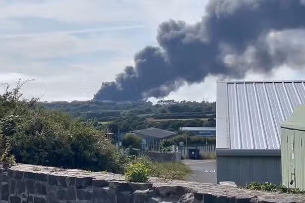 Black smoke fills the air as fire breaks out at former oil refinery